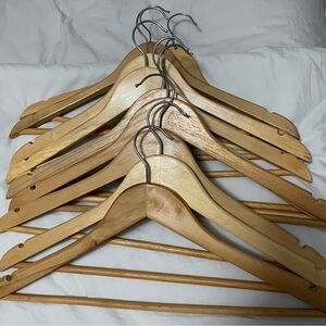 Ten good quality wooden hangers with dress notches